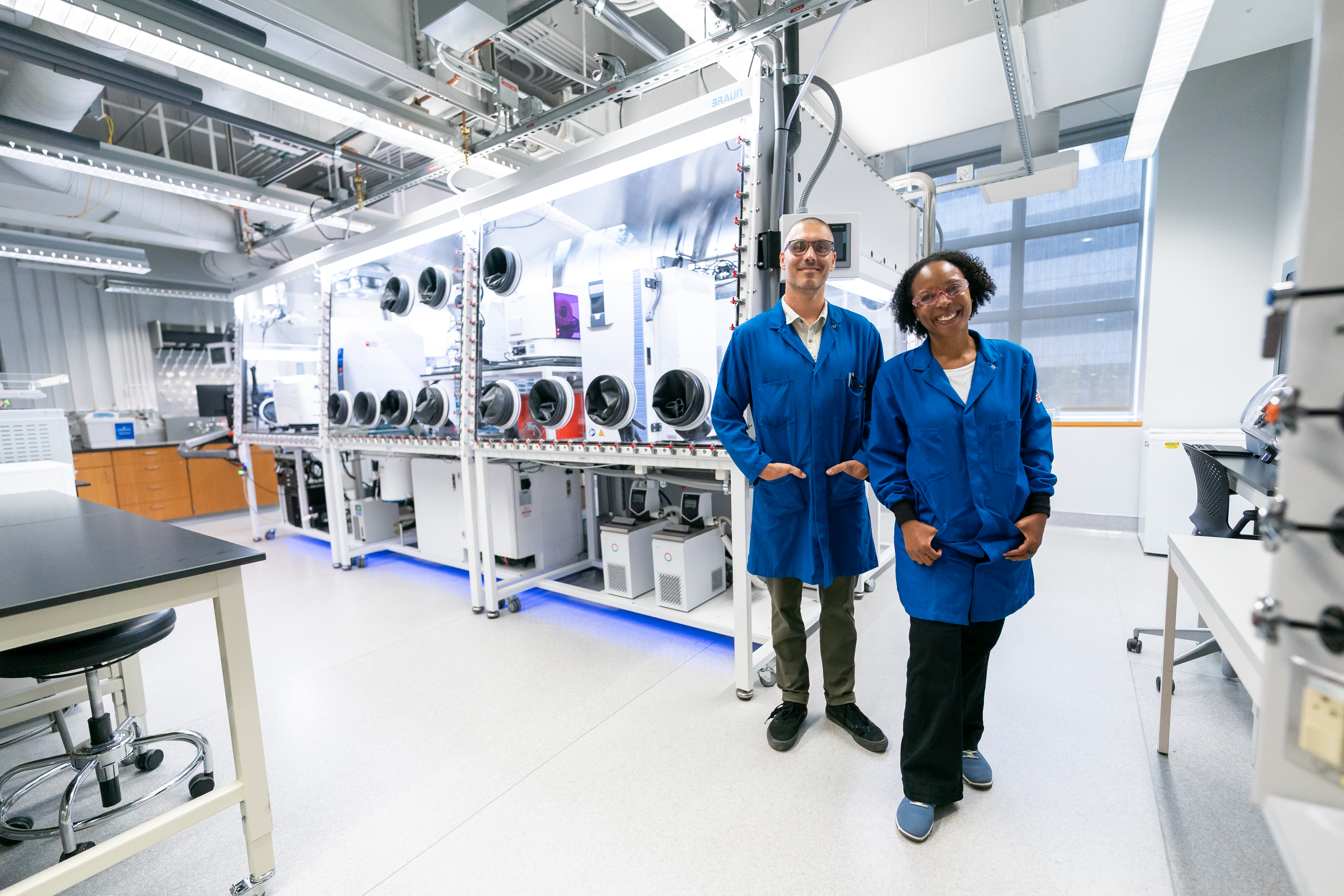 Lab Scientists standing in front of Anaerobic chamber at Launch Event 