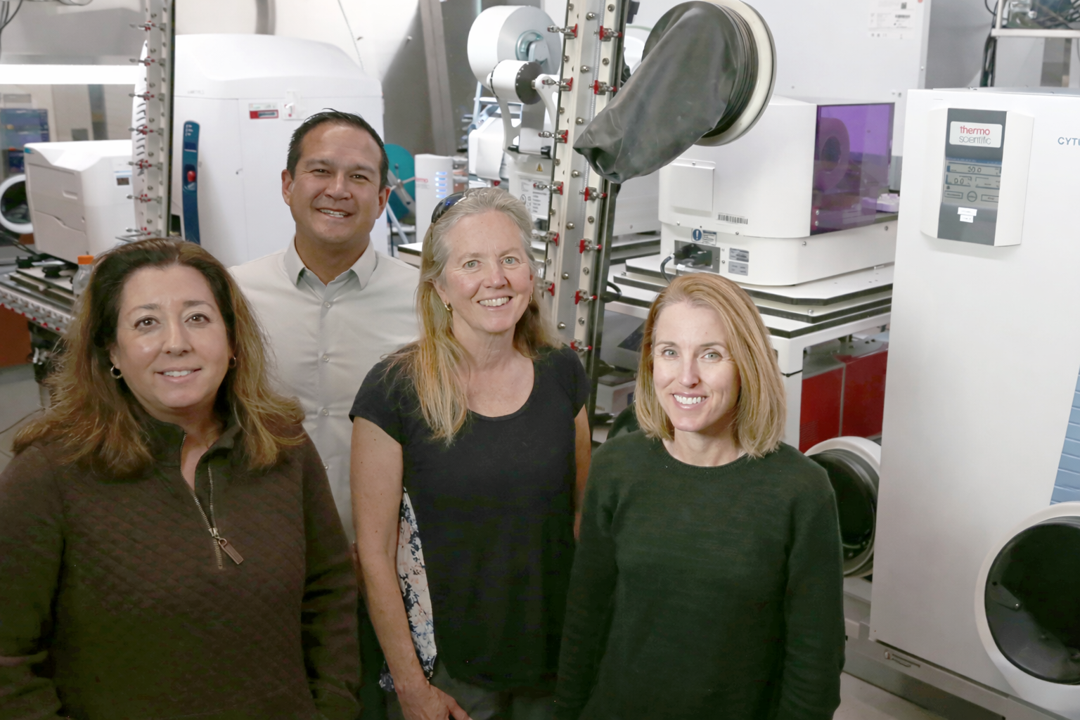 UC Santa Barbara collaborators (left to right) Michelle O’Malley, Ty Vernon, Jean Carlson, and Elaine Kirschke stand in the NSF ExFAB Biofoundry, a state-of-the- art facility central to the university’s newly awarded project.